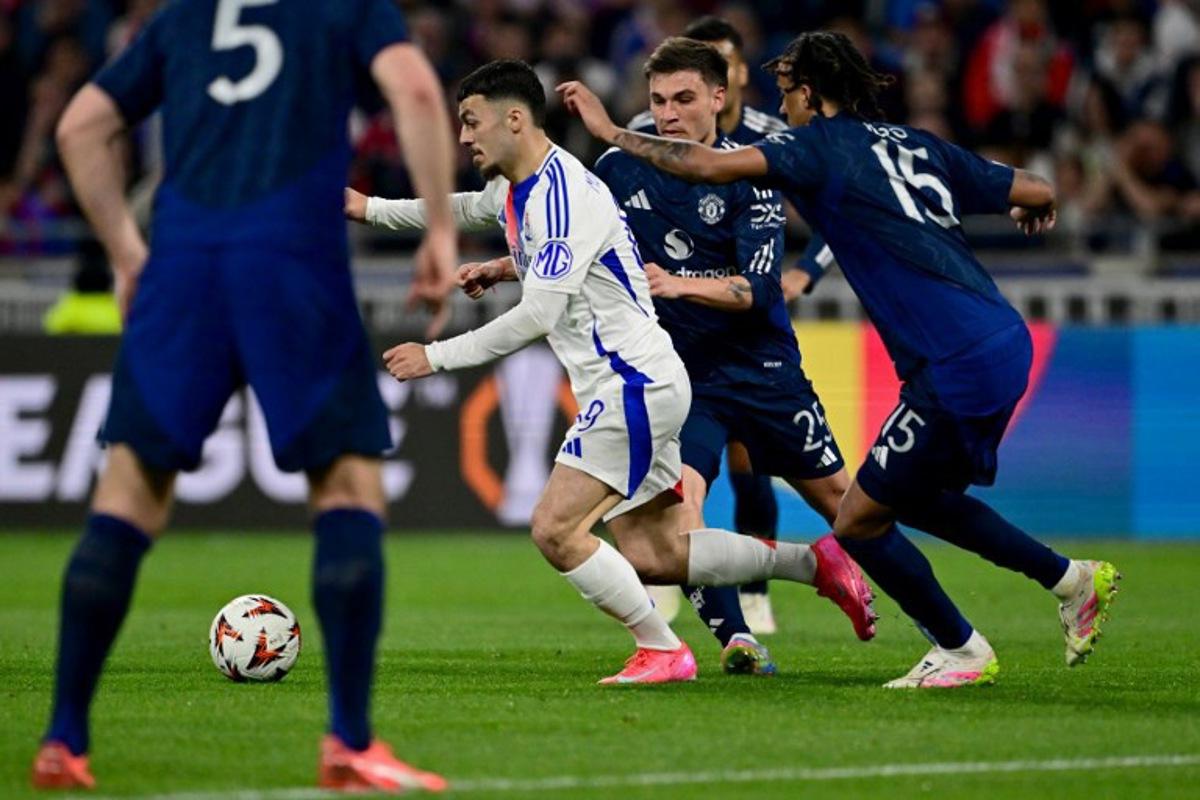 Lyon's Georgian forward #69 Georges Mikautadze (L) drives the ball during the UEFA Europa League Quarter final first leg football match between Olympique Lyonnais (OL) and Manchester United at the Parc Olympique Lyonnais Groupama stadium in Decines-Charpieu, central-eastern France, on April 10, 2025.  Olivier CHASSIGNOLE / AFP