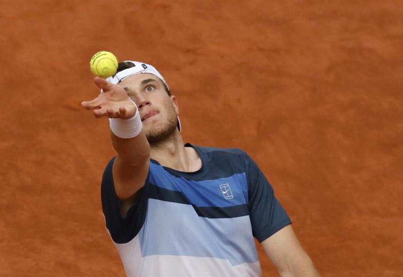 Britain's Jack Draper serves to Norway's Casper Ruud during their 2025 ATP Tour Madrid Open tennis tournament singles final match at the Caja Magica in Madrid, on May 4, 2025.  OSCAR DEL POZO / AFP