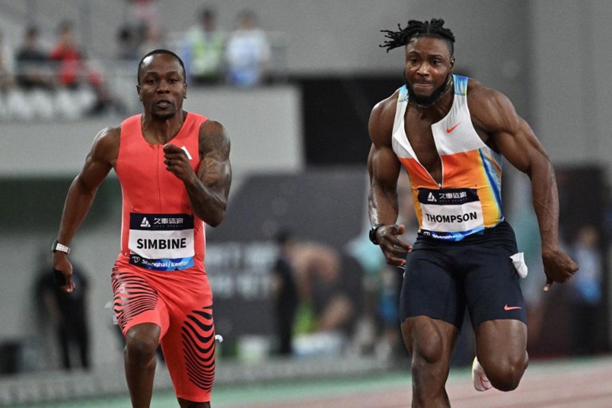 South Africa's Akani Simbine (L) and Jamaica's Kishane Thompson (R) compete in men's 100m during the Shanghai/Keqiao Diamond League athletics meeting in Keqiao, Shaoxing, in China's eastern Zhejiang province, on May 3, 2025.  Pedro PARDO / AFP