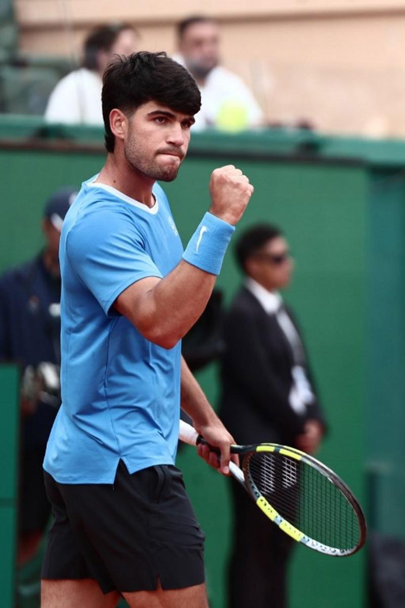 Spain's Carlos Alcaraz celebrates a point against Kazakhstan's Alexander Bublik during the Monte Carlo ATP Masters Series Tournament quarter final tennis match on Court Rainier III at the Monte-Carlo Country Club in Roquebrune-Cap-Martin, south-eastern France on April 10, 2026.  Thibaud MORITZ / AFP