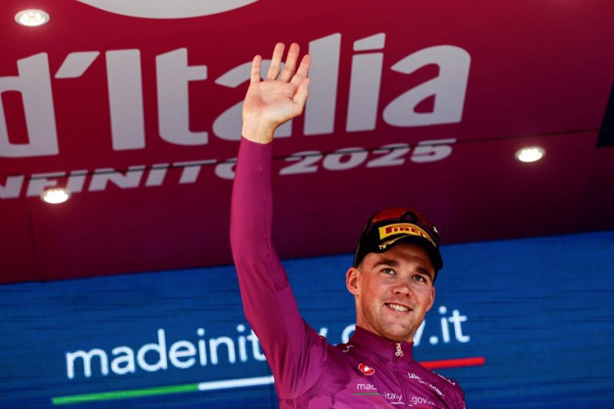 Lidl-Trek's Danish rider Mads Pedersen wearing the points classification mauve jersey (Maglia Ciclamino) poses on the podium after the second stage of the 108th Giro d'Italia cycling race, a 13.7km individual time-trial from Tirana to Tirana in Albania, on May 10, 2025.  Luca Bettini / AFP