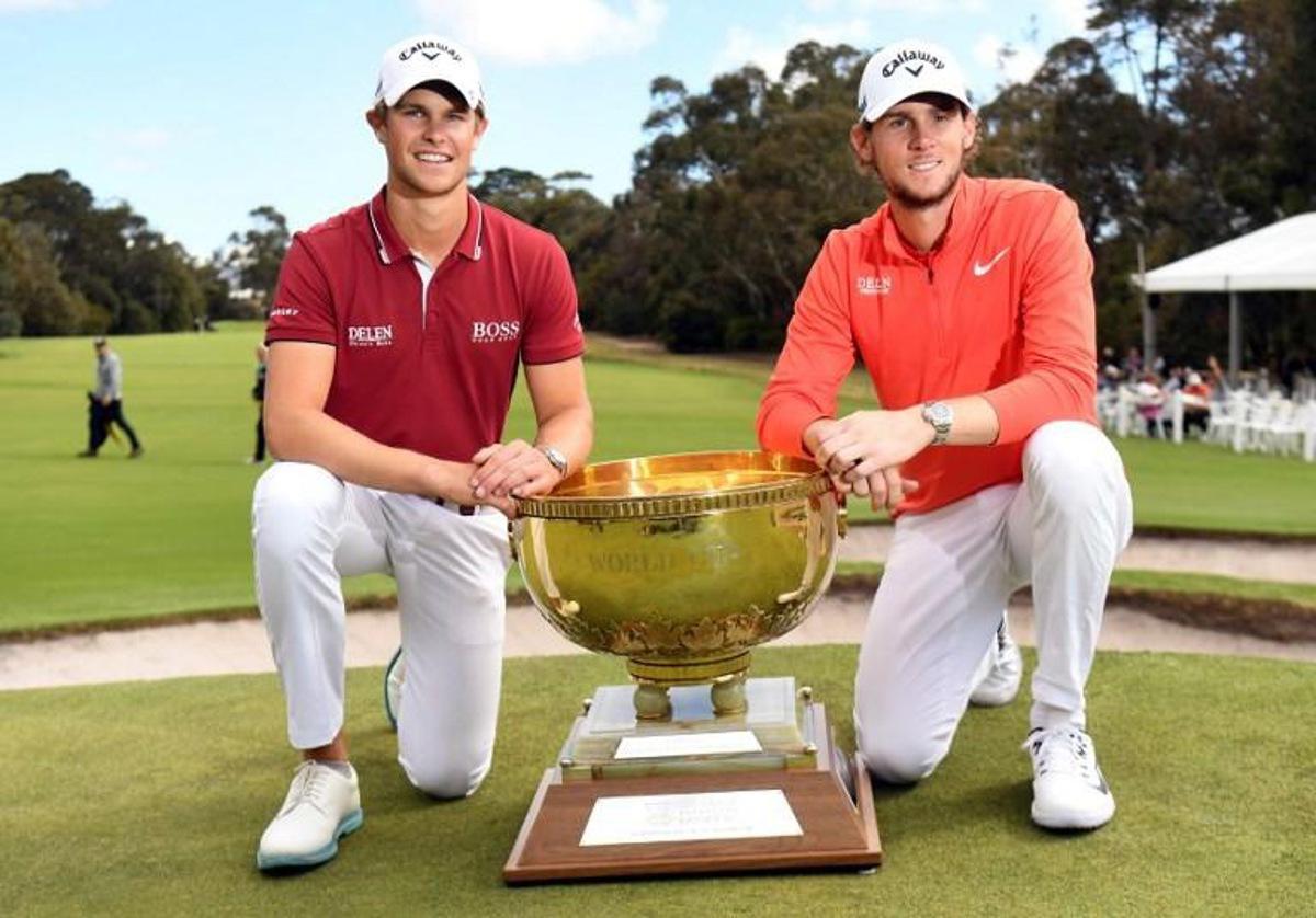 Thomas Detry (L) and Thomas Pieters of Belgium celebrate with the trophy after winning the World Cup of Golf at the Metropolitan Golf Club in Melbourne on November 25, 2018.  William WEST / AFP -- IMAGE RESTRICTED TO EDITORIAL USE - STRICTLY NO COMMERCIAL USE --

