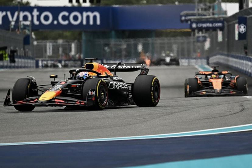 Red Bull Racing's Dutch driver Max Verstappen races ahead of McLaren's Australian driver Oscar Piastri during the 2025 Miami Formula One Grand Prix at Miami International Autodrome in Miami Gardens, Florida, on May 4, 2025.   Chandan Khanna / AFP