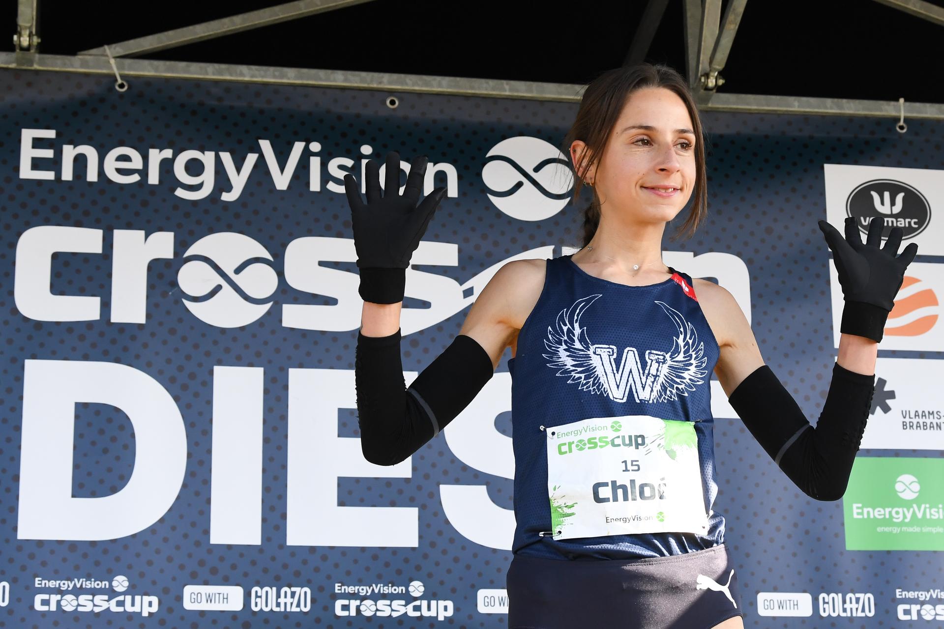 Belgian Chloe Herbiet celebrates on the podium after the women's race at the CrossCup cross country running athletics event in Diest, the fifth and final stage of the CrossCup competition, Sunday 16 February 2025. BELGA PHOTO JILL DELSAUX