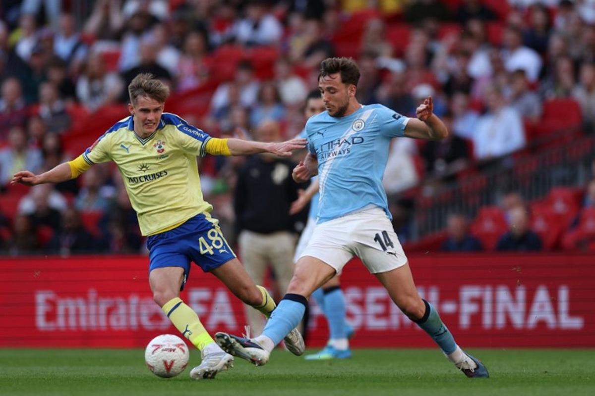 Southampton's Scottish midfielder #48 Cameron Bragg (L) vies with Manchester City's Spanish midfielder #14 Nico Gonzalez (R) during the English FA Cup semi final football match between Manchester City and Southampton at Wembley stadium in London, on April 25, 2026.  Adrian Dennis / AFP