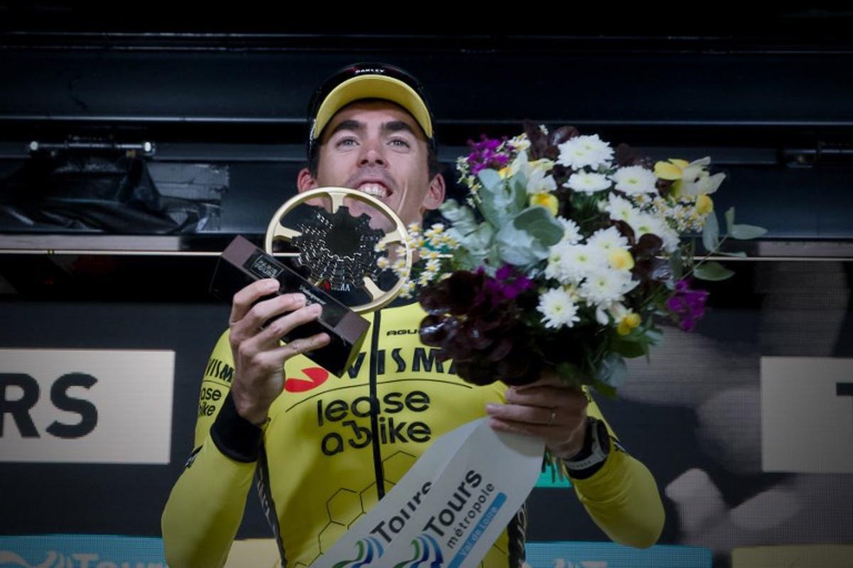 French rider of team Visma Lease A Bike Christophe Laporte celebrates on the podium after winning the 118th edition of the 213,9 km Paris-Tours one day cycling race, in Tours, central France on October 6, 2024.  GUILLAUME SOUVANT / AFP