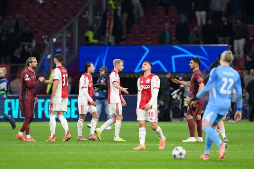 Ajax's players greet Galataray's players at the end of the UEFA Champions League, league phase day 4, football match between Ajax and Galatasaray at the Johan Cruijff ArenA in Amsterdam on November 5, 2025.  JOHN THYS / AFP