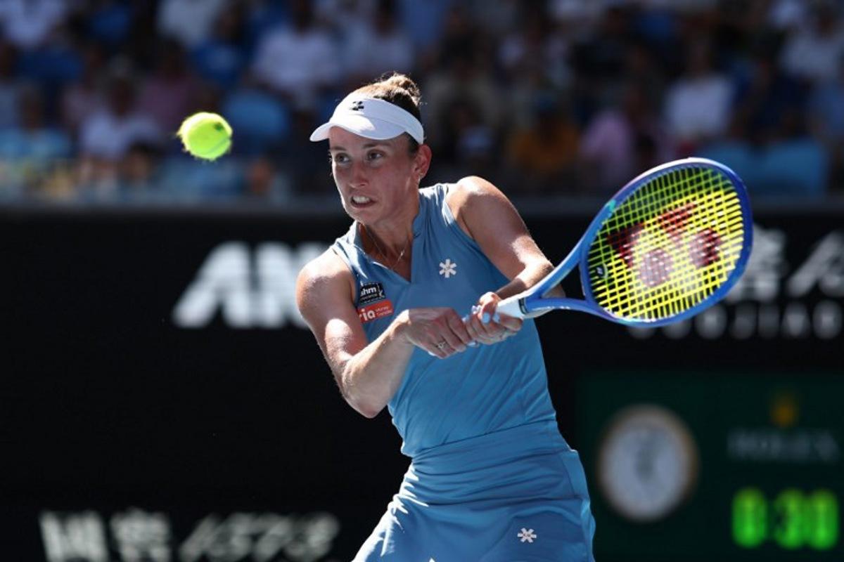 Belgium's Elise Mertens hits a return to Kazakhstan's Elena Rybakina during their women's singles match on day nine of the Australian Open tennis tournament in Melbourne on January 26, 2026.  IZHAR KHAN / AFP