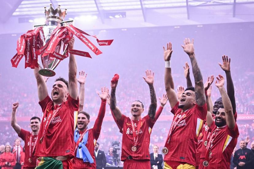 Liverpool's Portuguese striker #20 Diogo Jota lifts the Premier League trophy at the end of the English Premier League football match between Liverpool and Crystal Palace at Anfield in Liverpool, north west England on May 25, 2025. Liverpool equalises 1 - 1 against Crystal Palace. Paul ELLIS / AFP
