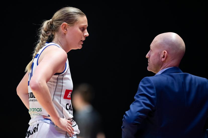 Mechelen's Catherine Reese and Mechelen's head coach Arvid Diels pictured during a basketball match between Kangoeroes Mechelen and Castors Braine, Saturday 09 March 2024 in Brussels, the final of the women's Belgian Basketball Cup. BELGA PHOTO KRISTOF VAN ACCOM