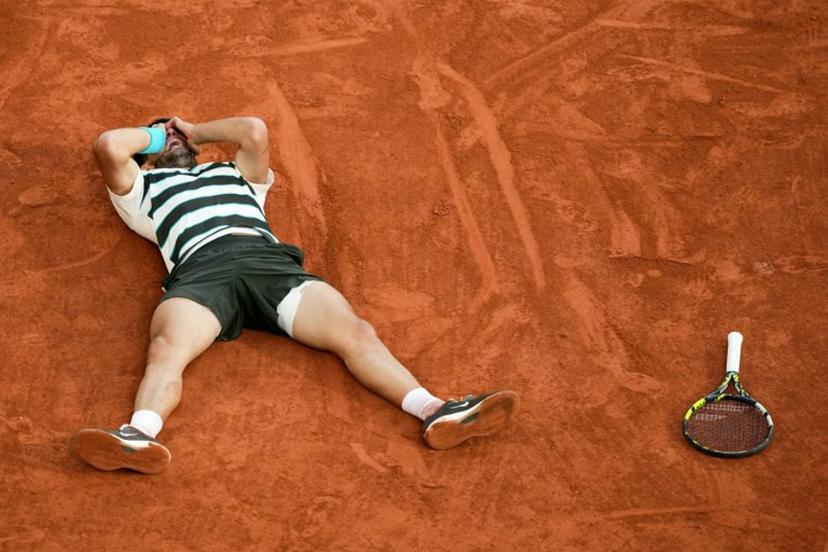 Spain's Carlos Alcaraz celebrates after winning the men's singles final match against Italy's Jannik Sinner on day 15 of the French Open tennis tournament on Court Philippe-Chatrier at the Roland-Garros Complex in Paris on June 8, 2025.  Dimitar DILKOFF / AFP