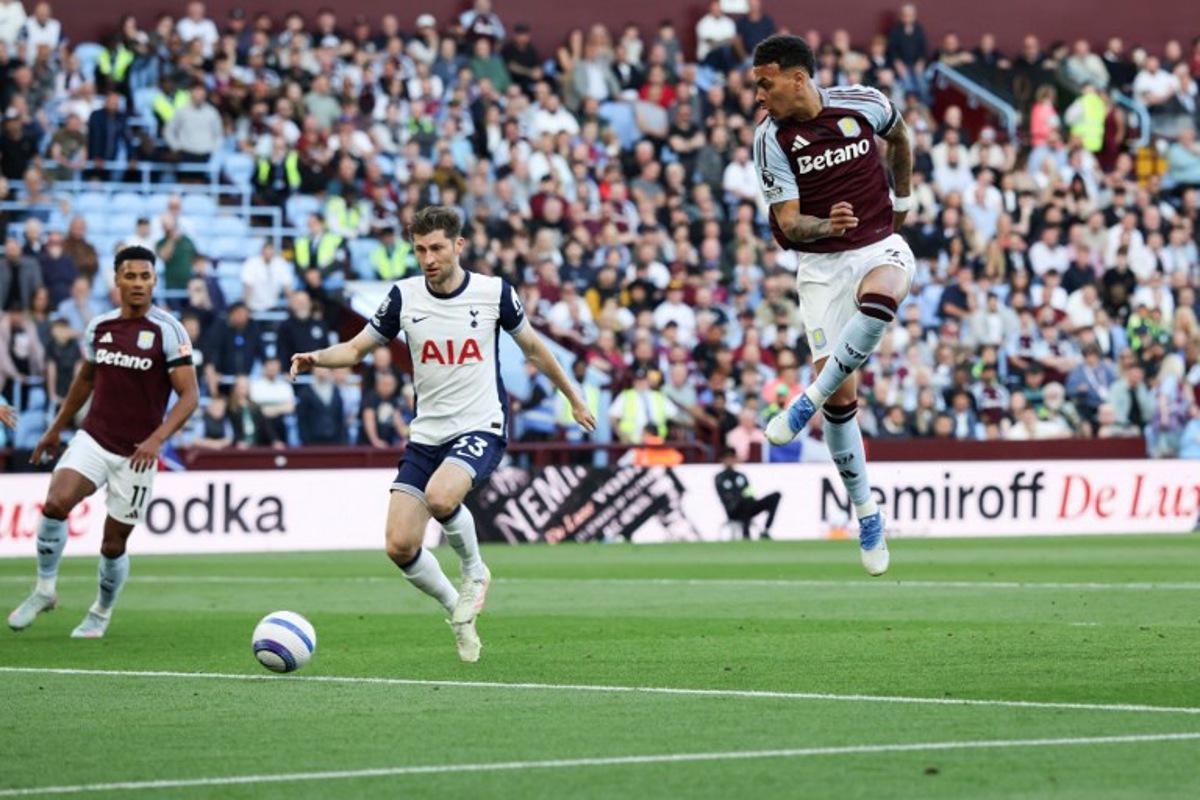 Aston Villa's English midfielder #27 Morgan Rogers (R) shoots but misses to score during the English Premier League football match between Aston Villa and Tottenham Hotspur at Villa Park in Birmingham, central England on May 16, 2025.  Darren Staples / AFP