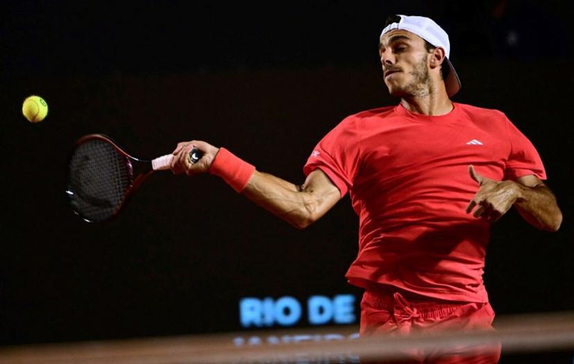Argentina's Francisco Cerundolo returns to Italy's Luciano Darderi during their second round tennis match at the ATP 500 Rio Open in Rio de Janeiro, Brazil on February 20, 2025.  MAURO PIMENTEL / AFP
