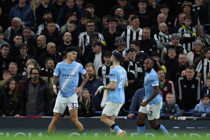 Manchester City's English midfielder #33 Nico O'Reilly (L) celebrates with temmates after scoring their second goal during the English Premier League football match between Manchester City and Newcastle at the Etihad Stadium in Manchester, north west England, on February 21, 2026.  Darren Staples / AFP