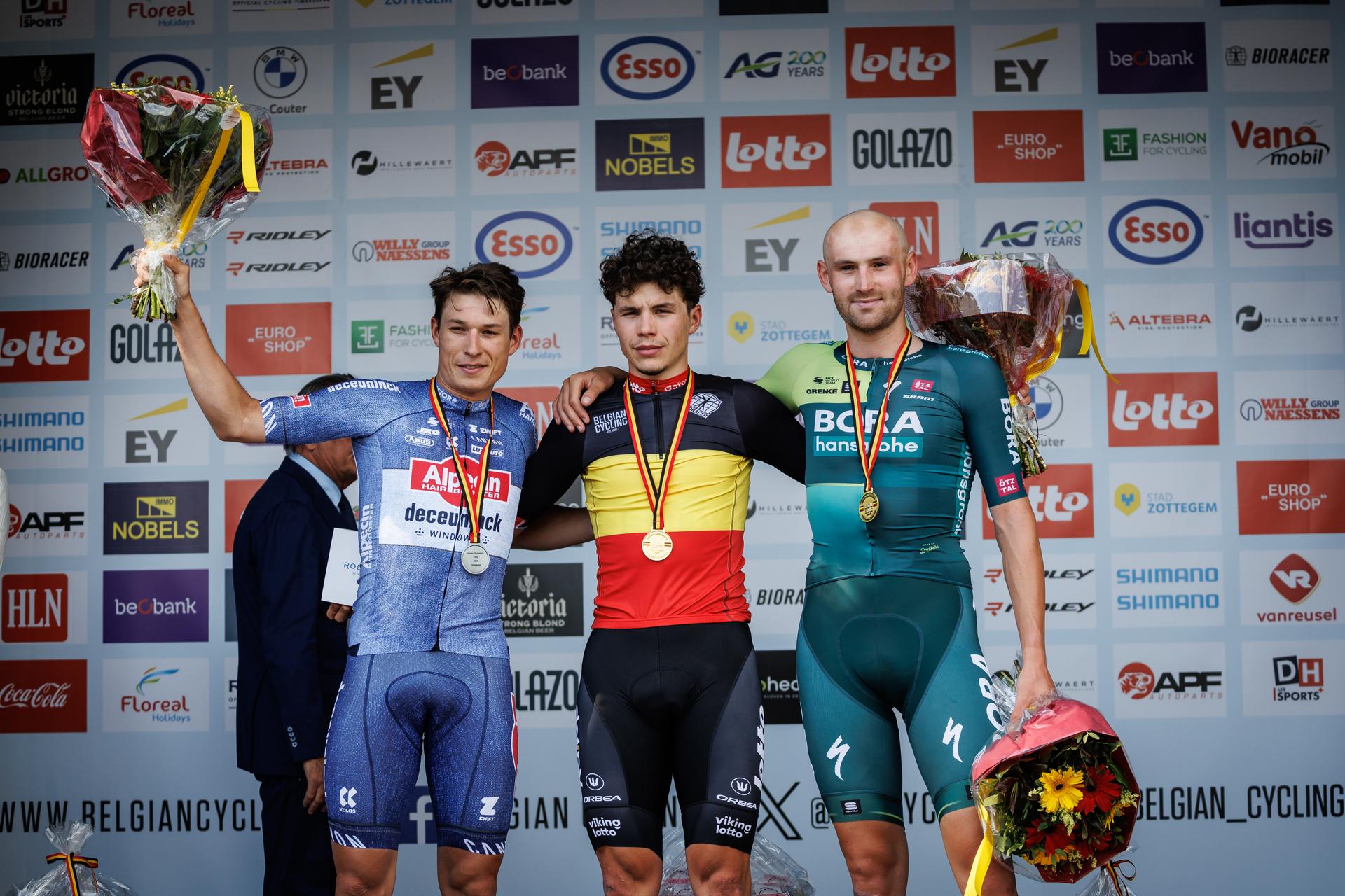 Belgian Jasper Philipsen of Alpecin-Deceuninck, Belgian Arnaud De Lie of Lotto Dstny and Belgian Jordi Meeus of Bora-Hansgrohe celebrate on the podium of the men's elite race of the Belgian Championships cycling, 220 km from Sint-Lievens-Houtem to Zottegem, on Sunday 23 June 2024. BELGA PHOTO KURT DESPLENTER