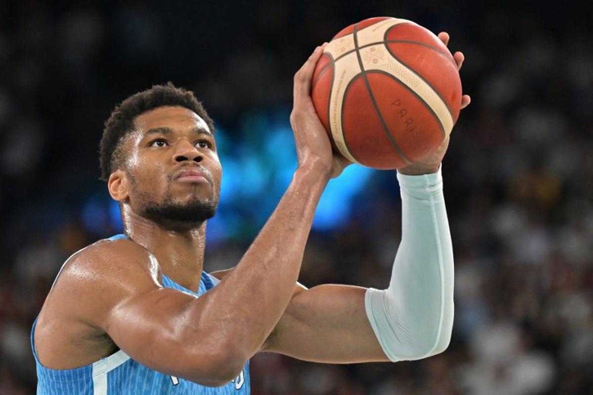 Greece's #34 Giannis Antetokounmpo takes a free throw in the men's quarterfinal basketball match between Germany and Greece during the Paris 2024 Olympic Games at the Bercy  Arena in Paris on August 6, 2024.  Damien MEYER / AFP