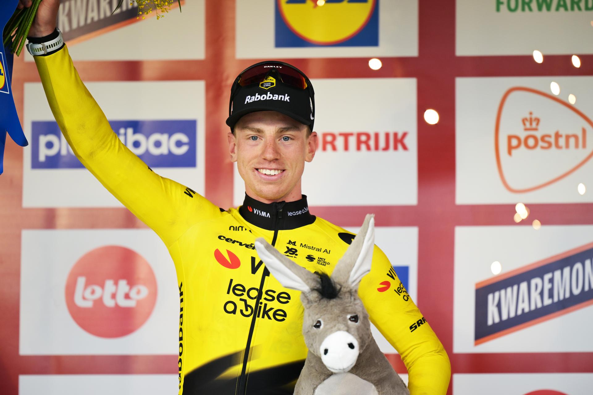 Great Britain's Matthew Brennan of Team Visma-Lease a Bike celebrates on the podium after winning the 78th edition of the men elite race of the Kuurne-Brussels-Kuurne one day cycling race, 195 km from Kuurne to Kuurne via Brussels, Sunday 01 March 2026.  BELGA PHOTO DAVID PINTENS