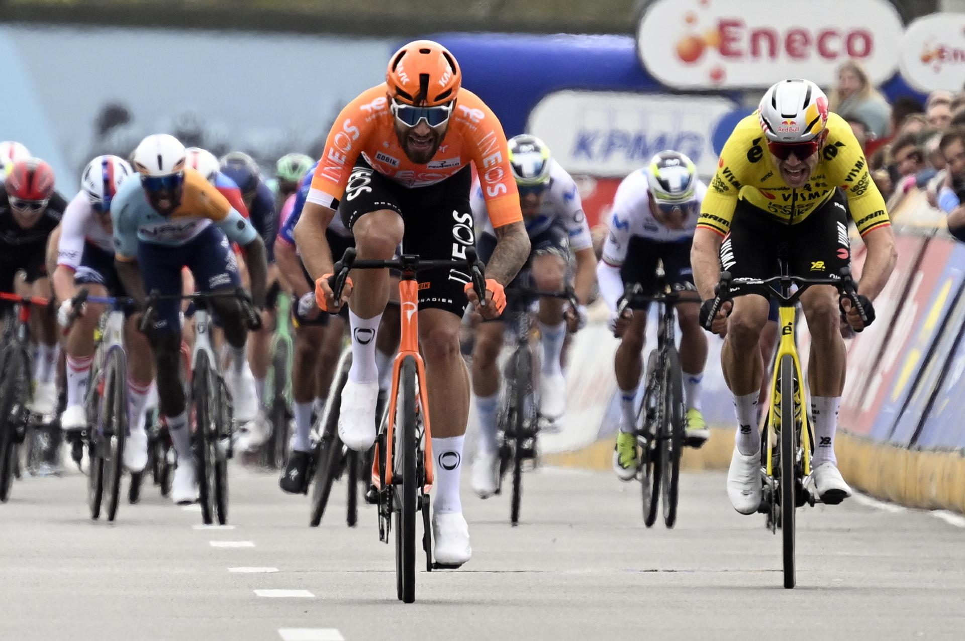 Italian Filippo Ganna of INEOS Grenadiers and Belgian Wout van Aert of Team Visma-Lease a Bike sprint to the finish of the men elite race of the 'Dwars Door Vlaanderen' cycling event, 184,6km from Roeselare to Waregem, Wednesday 01 April 2026. BELGA PHOTO TOM GOYVAERTS