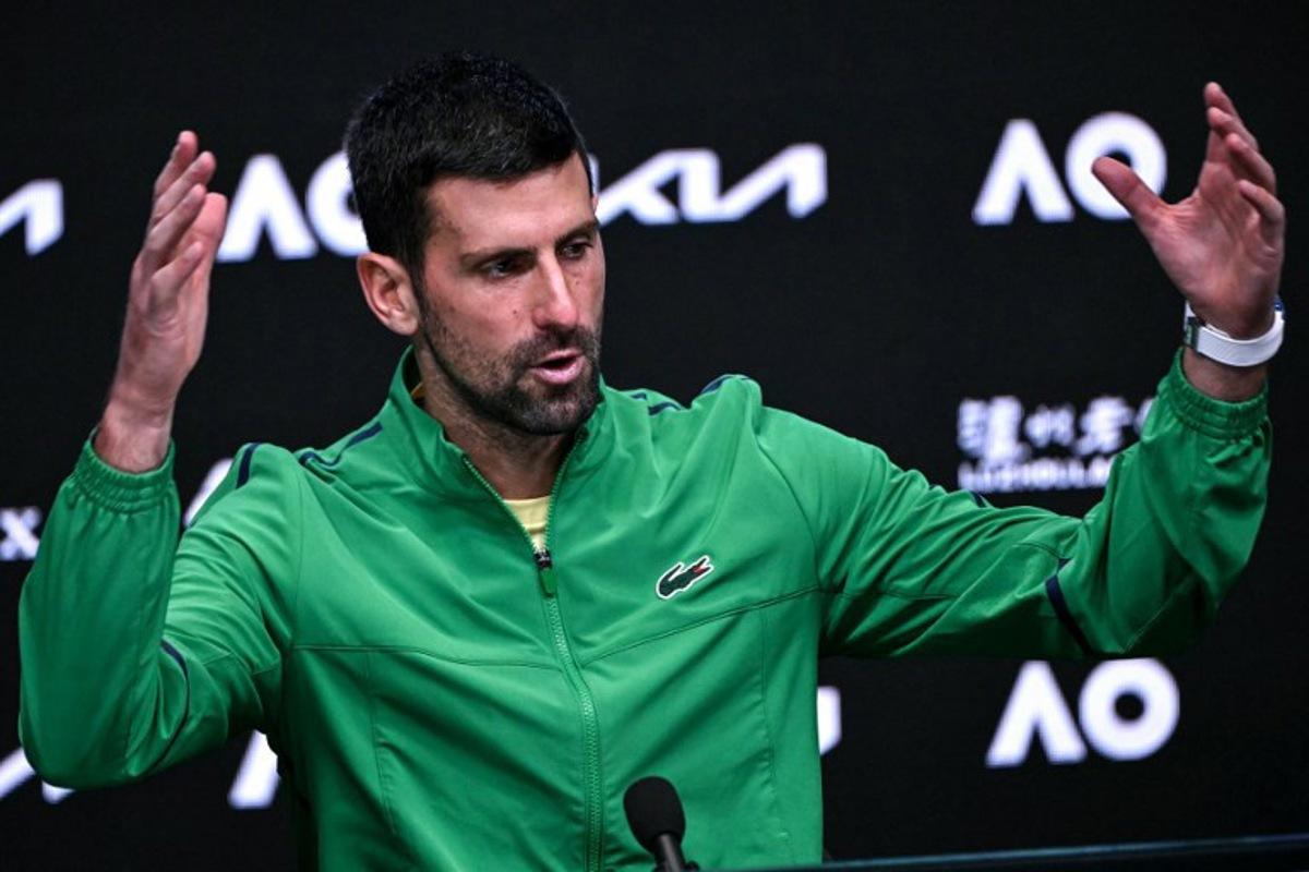 Serbia's Novak Djokovic speaks during a press conference after his defeat against Spain's Carlos Alcaraz in their men's singles final match on day fifteen of the Australian Open tennis tournament in Melbourne on February 1, 2026.  WILLIAM WEST / AFP
