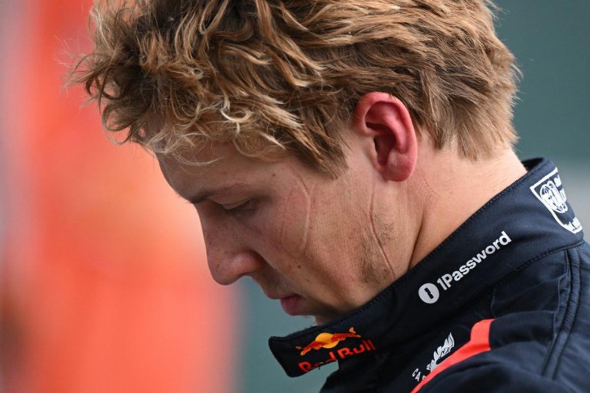 (FILES) Red Bull Racing's New Zealand driver Liam Lawson walks back to his team garage after getting out of his car at the end of the Formula One Chinese Grand Prix in Shanghai on March 23, 2025. Red Bull said on March 27, 2025 that Liam Lawson has been axed and replaced by Yuki Tsunoda, confirming days of speculation and just two race weekends into the F1 season.  GREG BAKER / AFP