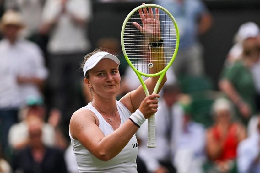 Czech Republic's Barbora Krejcikova celebrates winning against Philippines' Alexandra Eala their women's singles first round tennis match on the second day of the 2025 Wimbledon Championships at The All England Lawn Tennis and Croquet Club in Wimbledon, southwest London, on July 1, 2025.  Glyn KIRK / AFP