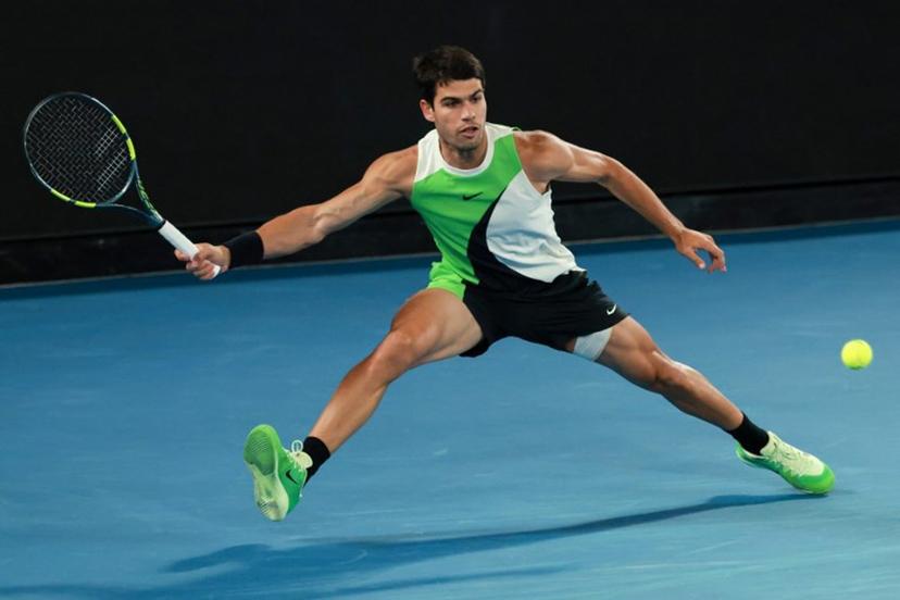 Spain's Carlos Alcaraz hits a return against Serbia's Novak Djokovic during their men's singles final match on day fifteen of the Australian Open tennis tournament in Melbourne on February 1, 2026.  DAVID GRAY / AFP