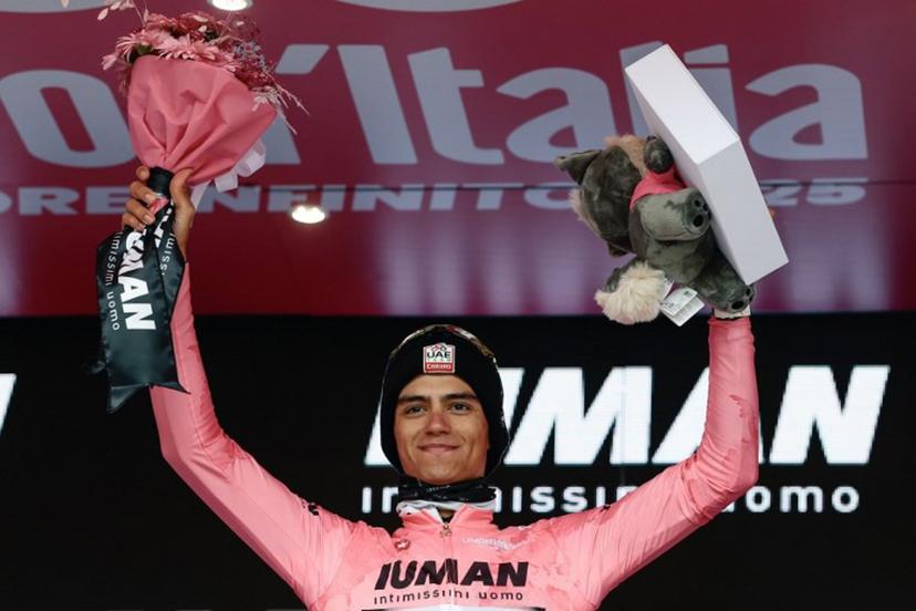 UAE Team Emirates XRG's Mexican rider Isaac Del Toro wearing the pink jersey of overall leader (Maglia Rosa) celebrates on the podium after the 14th stage of the 108th Giro d'Italia cycling race of 195kms from Treviso in Italy to Nova Gorica in Slovenia on May 24, 2025.  Luca Bettini / AFP