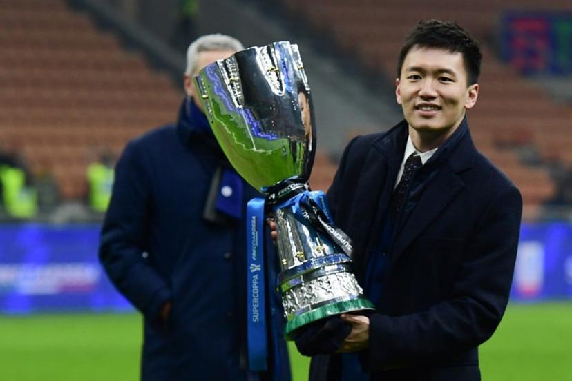 Inter Milan's  President Steven Zhang celebrates with the winner's trophy after Inter won the Italian Super Cup (Supercoppa italiana) football match between Inter and Juventus on January 12, 2022 at the San Siro stadium in Milan.    Miguel MEDINA / AFP