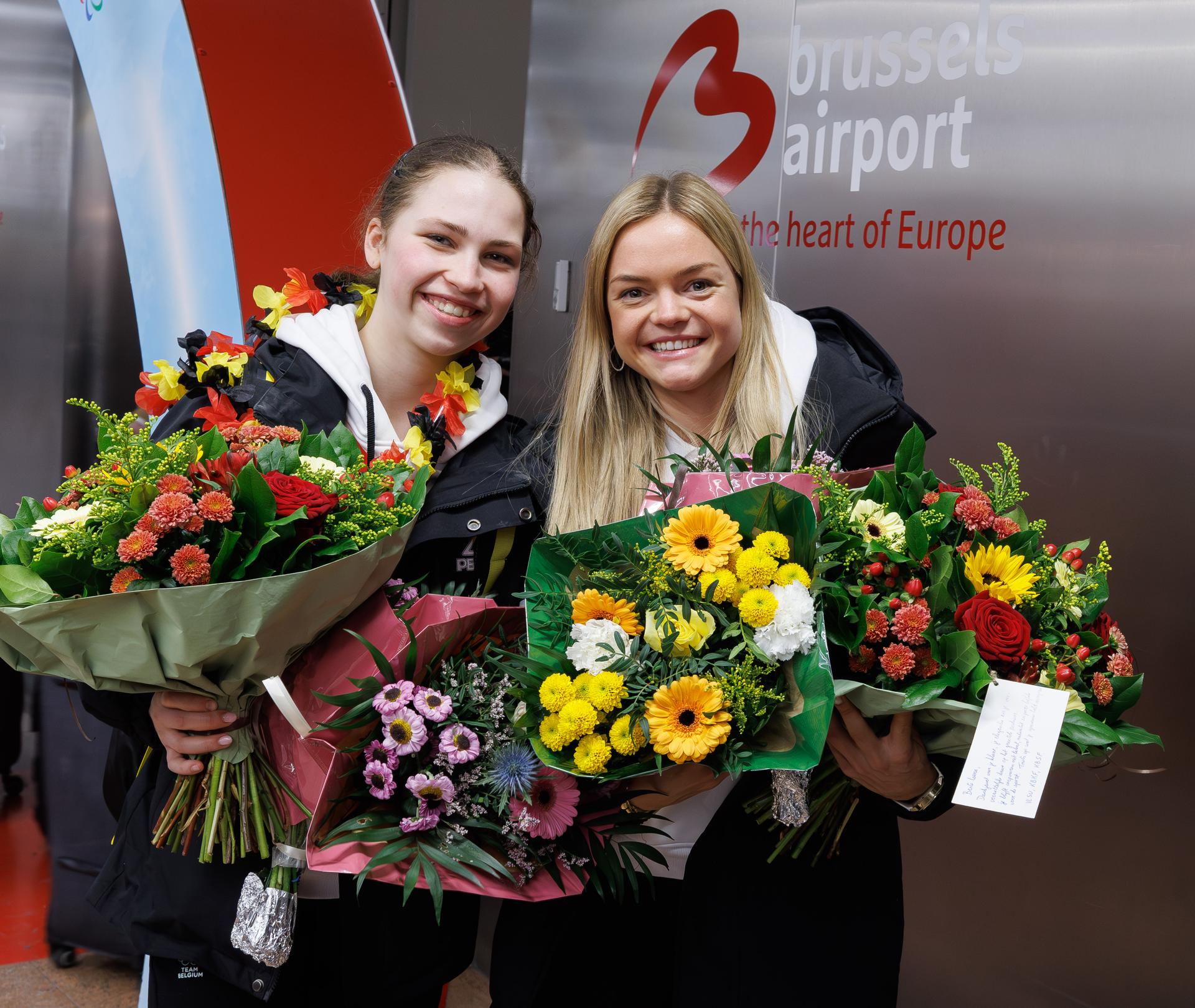 Belgian figure skater Nina Pinzarrone and Belgian figure skater Loena Hendrickx pictured during the arrival of Team Belgium from the Milano Cortina 2026 Olympic Winter Games, on Monday 23 February 2026, at Brussels Airport, in Zaventem. Belgium won a bronze medal in the shorttrack mixed relay. BELGA PHOTO BENOIT DOPPAGNE