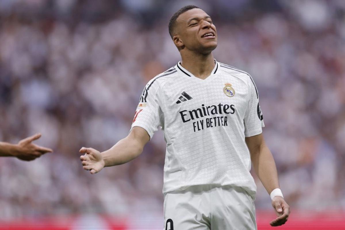 Real Madrid's French forward #09 Kylian Mbappe reacts during the Spanish league football match between Real Madrid CF and Real Sociedad at Santiago Bernabeu Stadium in Madrid on May 24, 2025.  OSCAR DEL POZO / AFP
