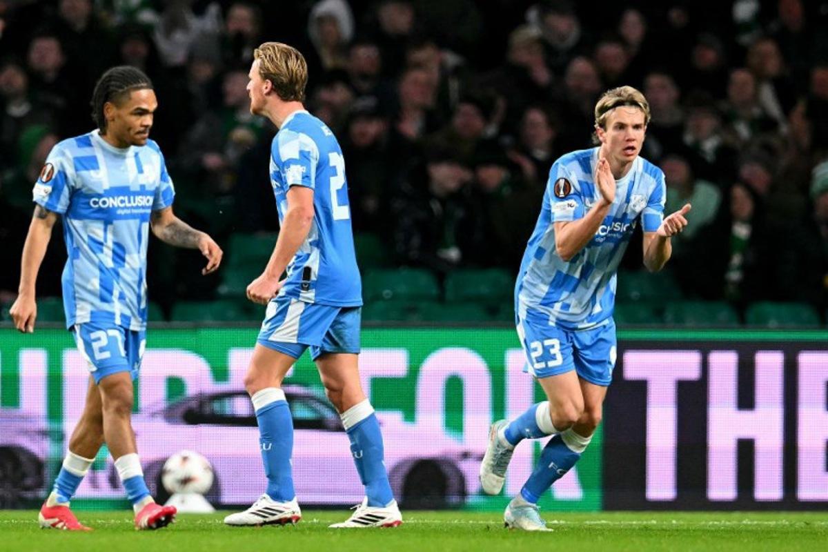 FC Utrecht's Dutch midfielder #20 Dani de Wit (C) celebrates scoring the team's first goal during the UEFA Europa League league-stage football match between Celtic and FC Utrecht at Celtic Park in Glasgow on January 29, 2026.  ANDY BUCHANAN / AFP