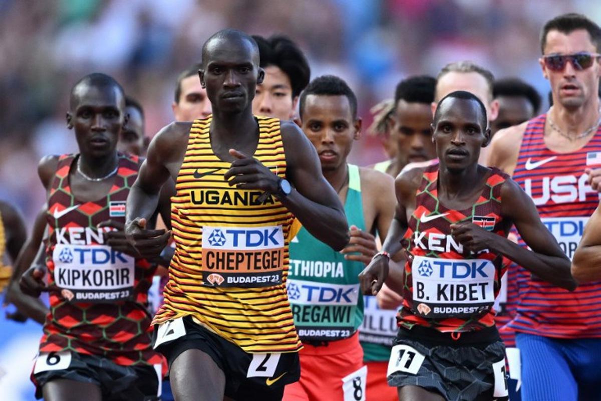 Uganda's Joshua Cheptegei, Kenya's Benard Kibet, Kenya's Nicholas Kipkorir, and other athletes compete in the men's 10,000m final during the World Athletics Championships at the National Athletics Centre in Budapest on August 20, 2023.  Jewel SAMAD / AFP
