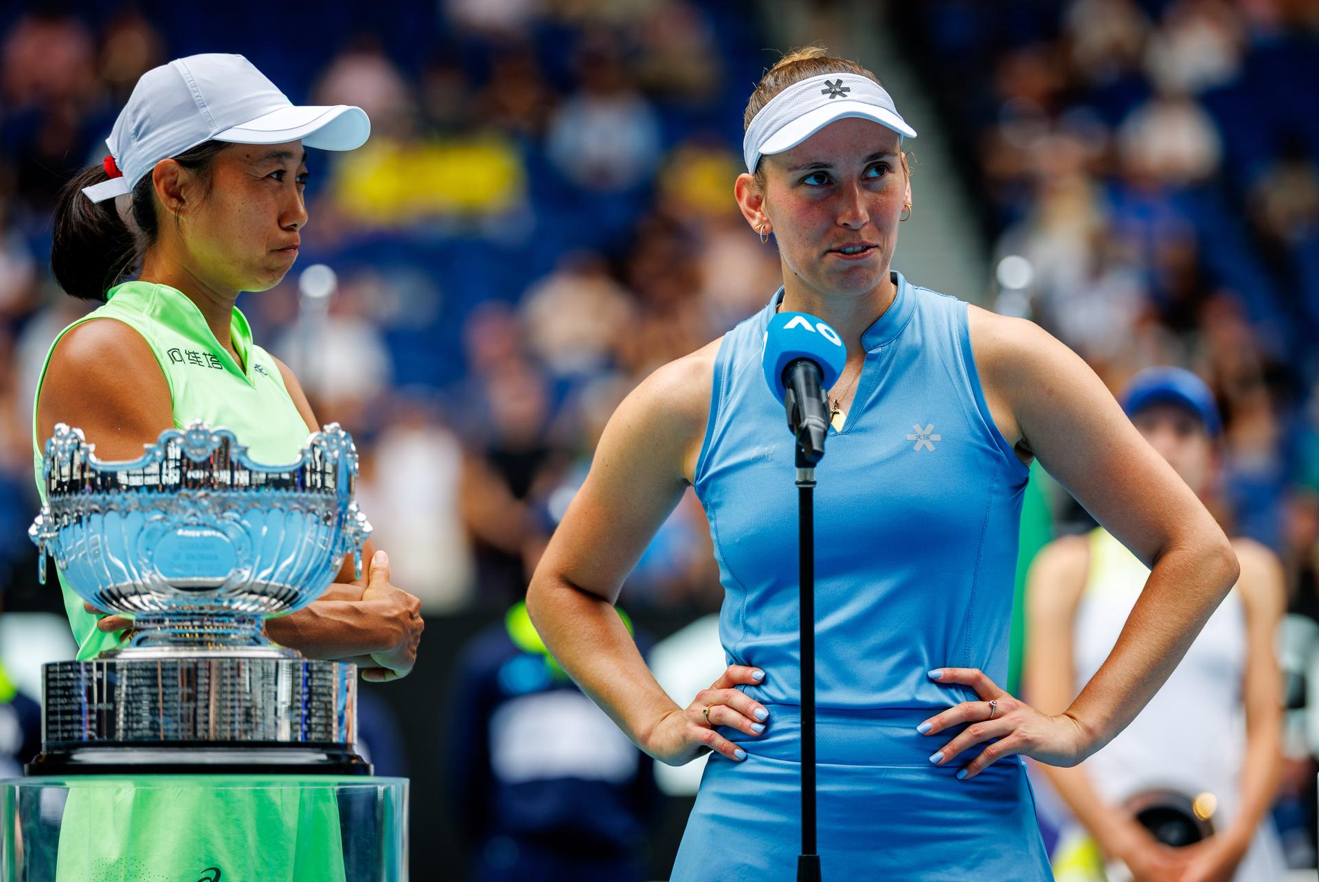 Belgian Elise Mertens and Chinese Shuai Zhang celebrate after winning a doubles tennis match between Belgian-Chinese pair Mertens-Zhang and Kazakh/Serbian pair Danilina/Krunic, in the final of the women doubles at the Australian Open, Melbourne Park, Melbourne on Saturday 31 January 2026. BELGA PHOTO PATRICK HAMILTON  --- BENELUX ONLY   ---