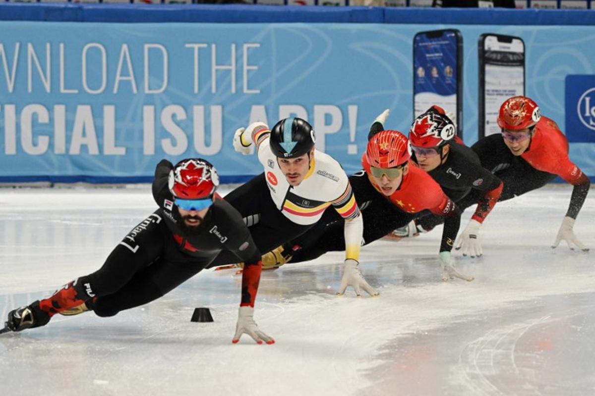 (L-R) Canada's Steven Dubois, Belgium's Stijn Desmet, China's Lin Xiaojun, Canada's Jordan Pierre-Gilles and China's Sun Long compete in the Final A of the men's 500m at the ISU World Cup Short Track Speed Skating event in Beijing on December 10, 2023.  Jade Gao / AFP