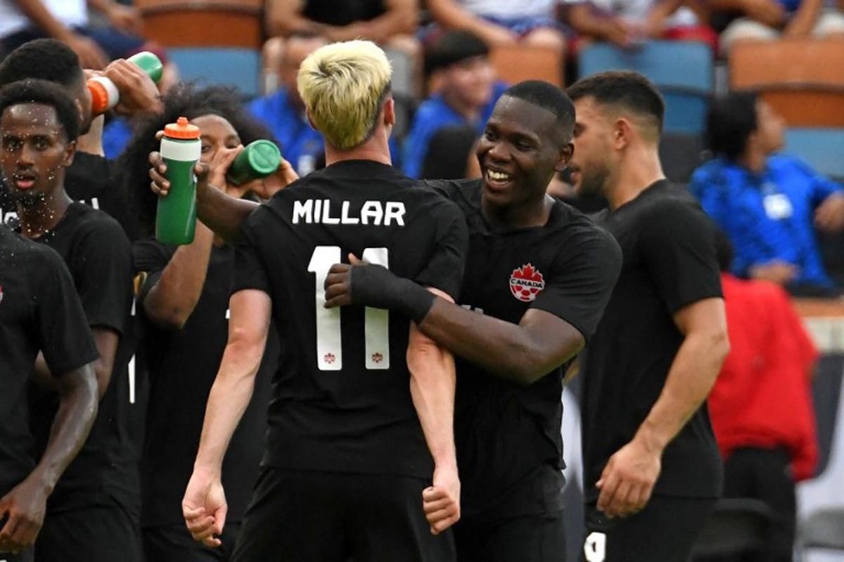 Canada's midfielder Liam Millar (C) celebrates scoring his team's fourth goal during the Concacaf 2023 Gold Cup Group D football match between Canada and Cuba at Shell Energy Stadium, Houston, Texas on July 4, 2023.  Mark Felix / AFP