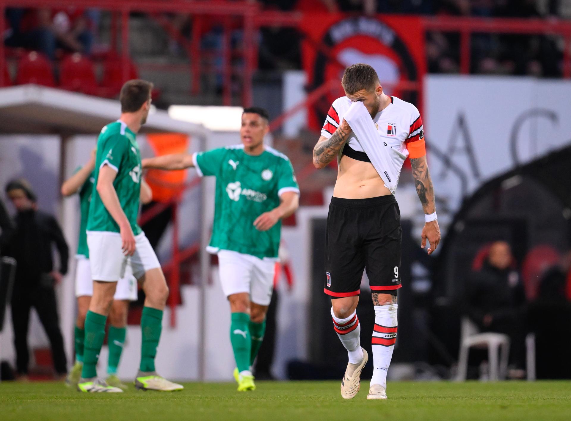 Rwdm's Piotr Parzyszek reacts during a soccer match between RWD Molenbeek and Lommel SK, Friday 11 April 2025 in Brussels, on day 29 of the 2024-2025 'Challenger Pro League' 1B second division of the Belgian championship. BELGA PHOTO JOHN THYS