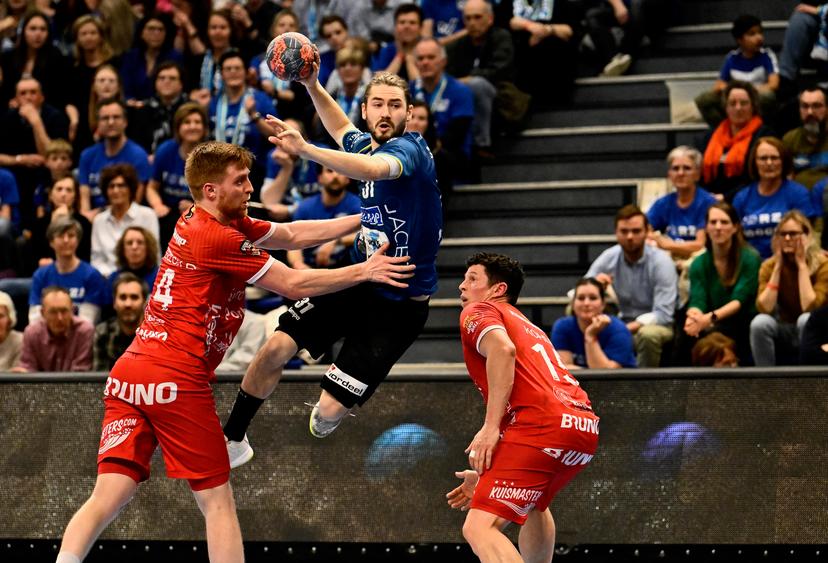 Pelt's Door Vandebeeck and Bocholt's Pieter Strauven fight for the ball during a game between Achilles Bocholt and Sporting Pelt, the men's final of the Belgian handball cup, Saturday 01 April 2023, in Hasselt. BELGA PHOTO JOHAN EYCKENS