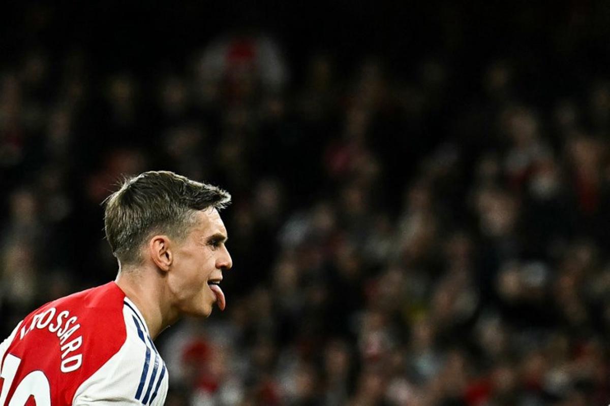 Arsenal's Belgian midfielder #19 Leandro Trossard celebrates after scoring his team second goal during the English Premier League football match between Arsenal and Crystal Palace at the Emirates Stadium in London on April 23, 2025.   Ben STANSALL / AFP