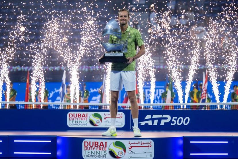 Russia's Daniil Medvedev celebrates with the trophy after winning his men's singles final match against Netherlands' Tallon Griekspoor at the Dubai Duty Free Tennis tournament in Dubai on February 28, 2026.  Ryan Lim / AFP