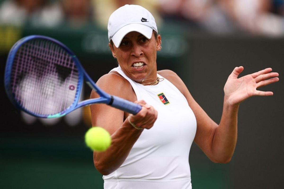 US player Madison Keys plays a forehand return to Serbia's Olga Danilovic during their women's singles second round tennis match on the third day of the 2025 Wimbledon Championships at The All England Lawn Tennis and Croquet Club in Wimbledon, southwest London, on July 2, 2025.  HENRY NICHOLLS / AFP