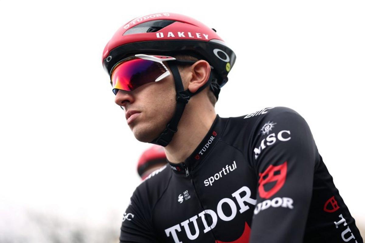 Tudor Pro Cycling Team's French rider Mathys Rondel waits for the start of the 1st stage of the Paris-Nice cycling race, 170.9 km between Achères and Carrières-sous-Poissy, on March 8, 2026.  Anne-Christine POUJOULAT / AFP