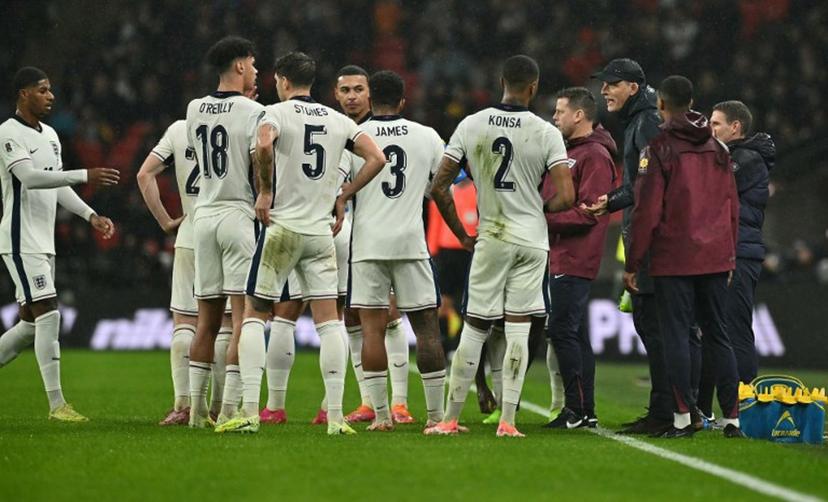 England's German head coach Thomas Tuchel talks to his players during a drinks break during the men's football World Cup 2026 Group K qualifier between England and Serbia at Wembley Stadium in London on November 13, 2025.  Ben STANSALL / AFP