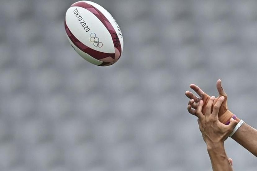 Fiji's Mele Derenalagi (R) fights for the ball with Argentina's Lucio Cinti (L) in the men's semi-final rugby sevens match between Argentina and Fiji during the Tokyo 2020 Olympic Games at the Tokyo Stadium in Tokyo on July 28, 2021.  Ben STANSALL / AFP