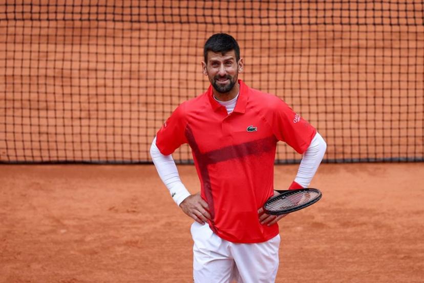 Serbia's Novak Djokovic reacts after asking to close the ceiling following a light rain during his men's singles match against US Mackenzie Mcdonald on day 3 of the French Open tennis tournament on Court Philippe-Chatrier at the Roland-Garros Complex in Paris on May 27, 2025.  FRANCK FIFE / AFP