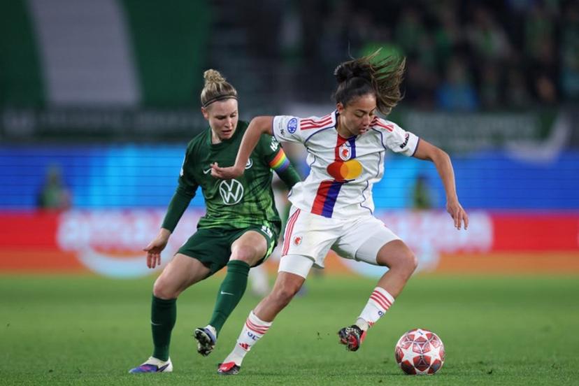 Lyon's French defender #04 Selma Bacha and VfL Wolfsburg's German midfielder #10 Svenja Huth vie for the ball during the UEFA Women's Champions League Quarter final First Leg football match VfL Wolfsburg v Olympique Lyonnais (OL) in Wolfsburg, northern Germany, on March 24, 2026.  Ronny HARTMANN / AFP