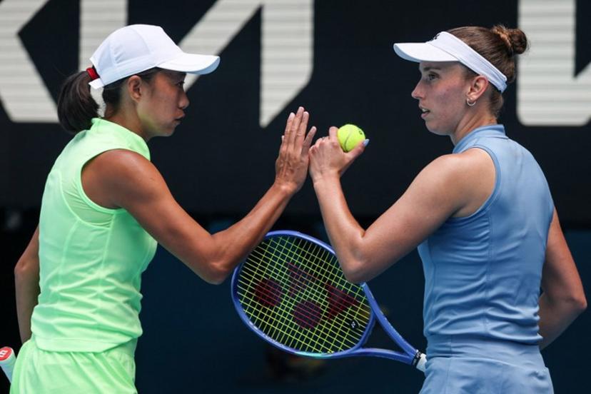 China's Zhang Shuai (L) gestures to partner Belgium's Elise Mertens during their women's doubles final match against Kazakhstan's Anna Danilina and Serbia's Aleksandra Krunic on day fourteen of the Australian Open tennis tournament in Melbourne on January 31, 2026.  DAVID GRAY / AFP