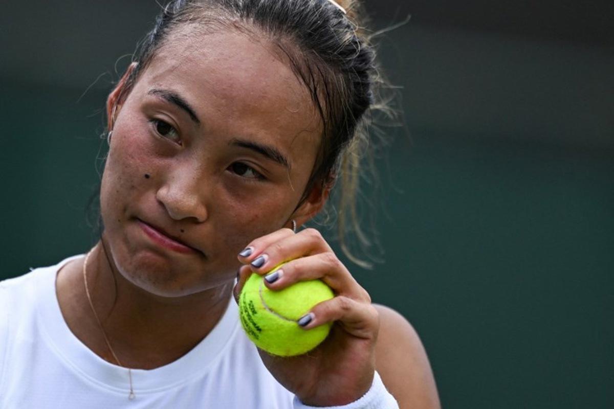 China's Qinwen Zheng reacts as she plays against Czech Republic's Katerina Siniakova during their women's singles first round tennis match on the second day of the 2025 Wimbledon Championships at The All England Lawn Tennis and Croquet Club in Wimbledon, southwest London, on July 1, 2025.  Kirill KUDRYAVTSEV / AFP