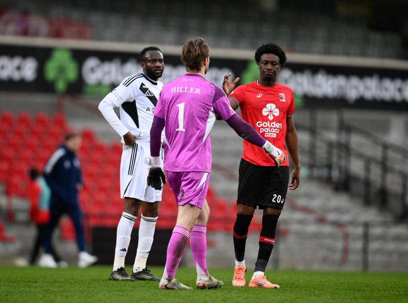 Rwdm's Kwasi Poku and Eupen's goalkeeper Marco Hiller react after a soccer game between RWDM Brussels and KAS Eupen, Sunday 01 March 2026 in Brussels, on day 27 of the 2025-2026 'Challenger Pro League' 1B second division of the Belgian championship. BELGA PHOTO JOHN THYS