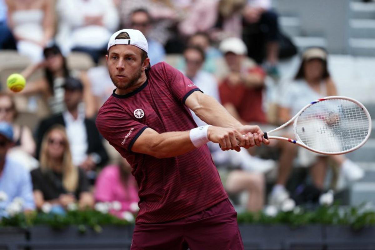 Netherlands' Tallon Griekspoor plays a backhand return to Germany's Alexander Zverev during their men's singles match on day 9 of the French Open tennis tournament on Court Suzanne-Lenglen at the Roland-Garros Complex in Paris on June 2, 2025.  Dimitar DILKOFF / AFP