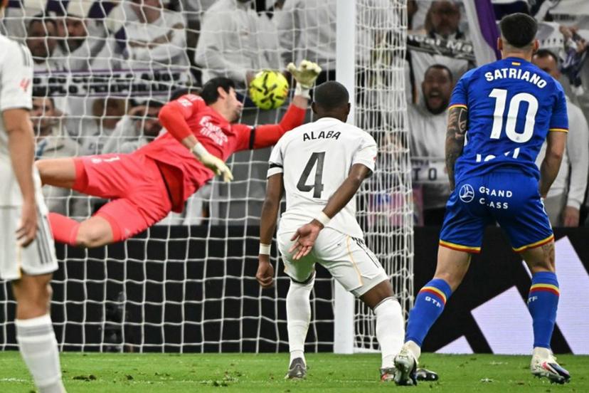 Getafe's Uruguayan forward #10 Martín Satriano scores the opening goal during the Spanish league football match between Real Madrid CF and Getafe CF at Santiago Bernabeu Stadium in Madrid on March 2, 2026.  Javier SORIANO / AFP